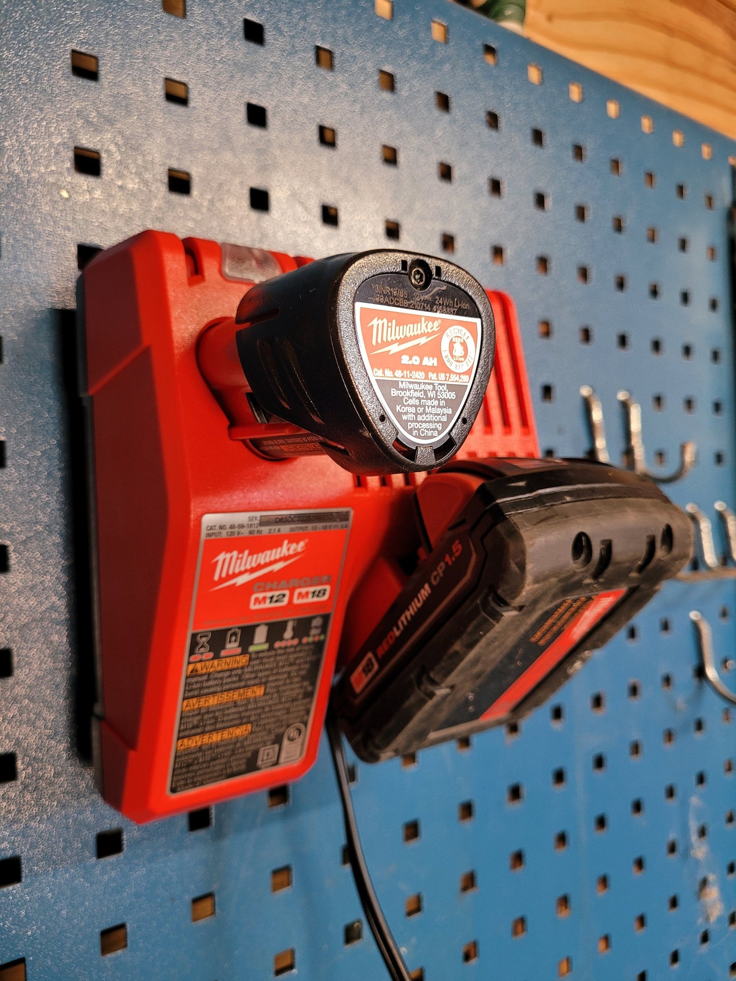 Milwaukee M12 M18 Charger Mount, Cat. No. 48-59-1812, Uses Two Neodymium Bar Magnets for Strong Hold on Metal Surface