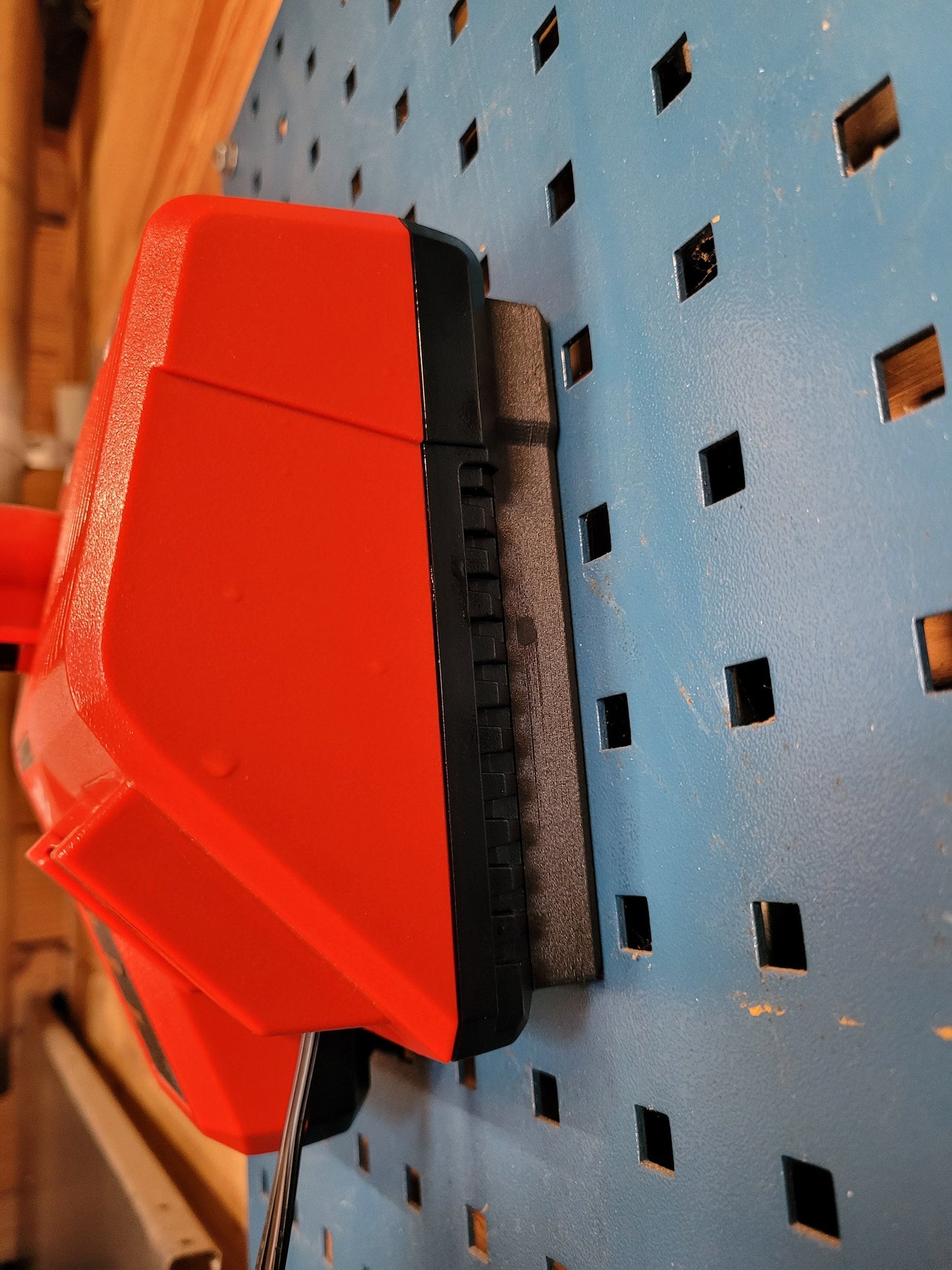 Milwaukee M12 M18 Charger Mount, Cat. No. 48-59-1812, Uses Two Neodymium Bar Magnets for Strong Hold on Metal Surface