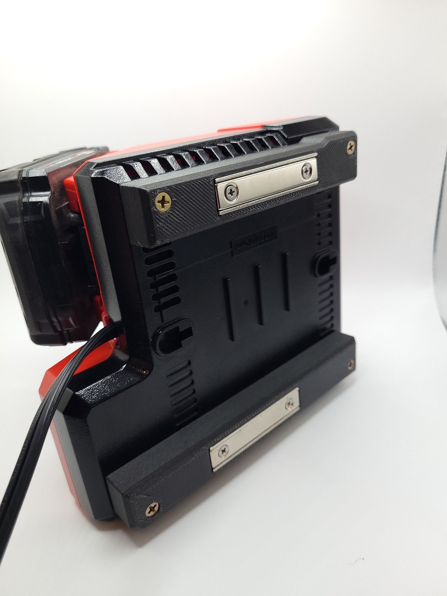 Milwaukee M12 M18 Charger Mount, Cat. No. 48-59-1812, Uses Two Neodymium Bar Magnets for Strong Hold on Metal Surface