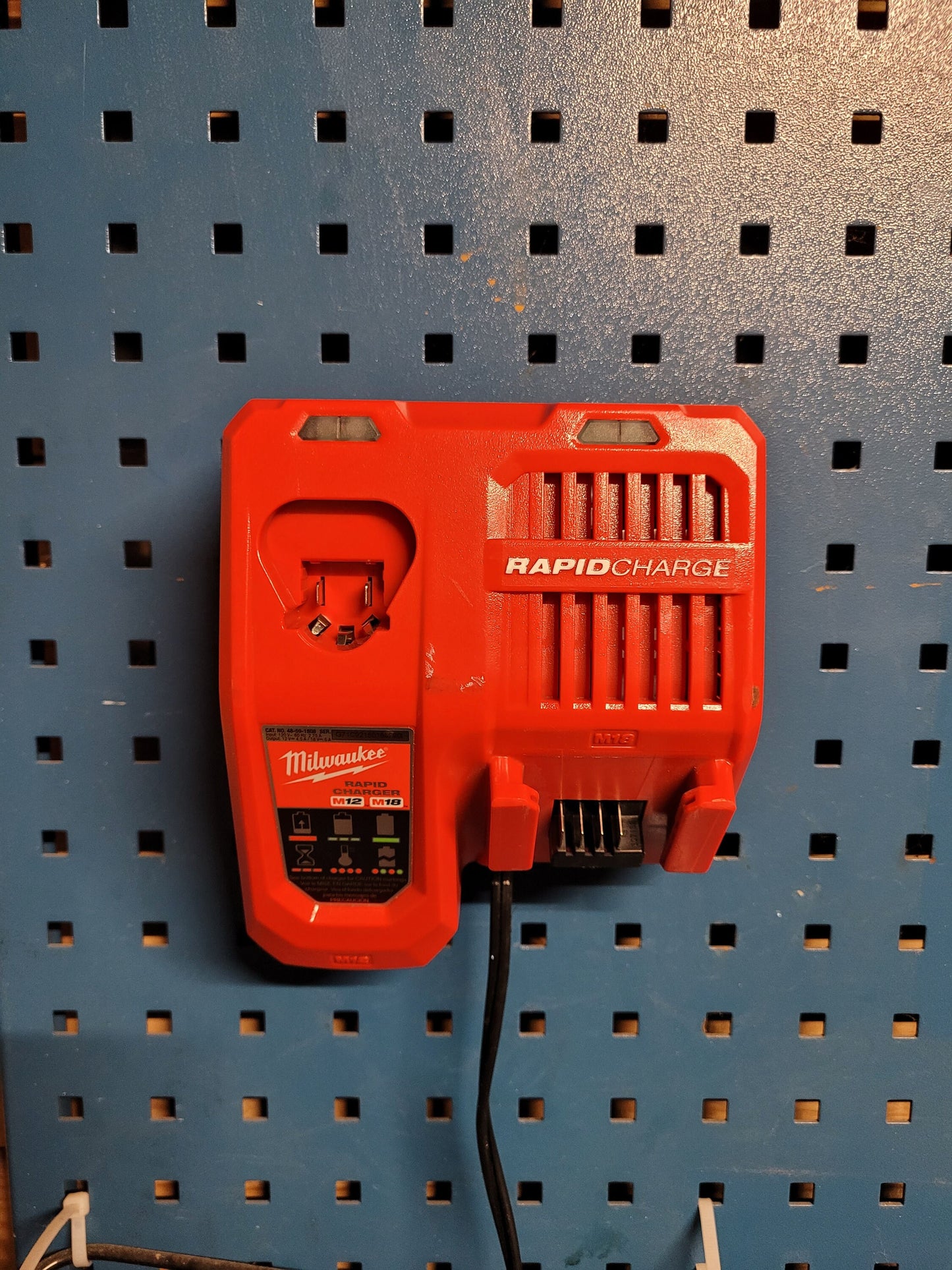Milwaukee M12 M18 Rapid Charger Mount, Cat. No. 48-59-1808, Uses Two Neodymium Bar Magnets for Strong Hold on Metal Surface